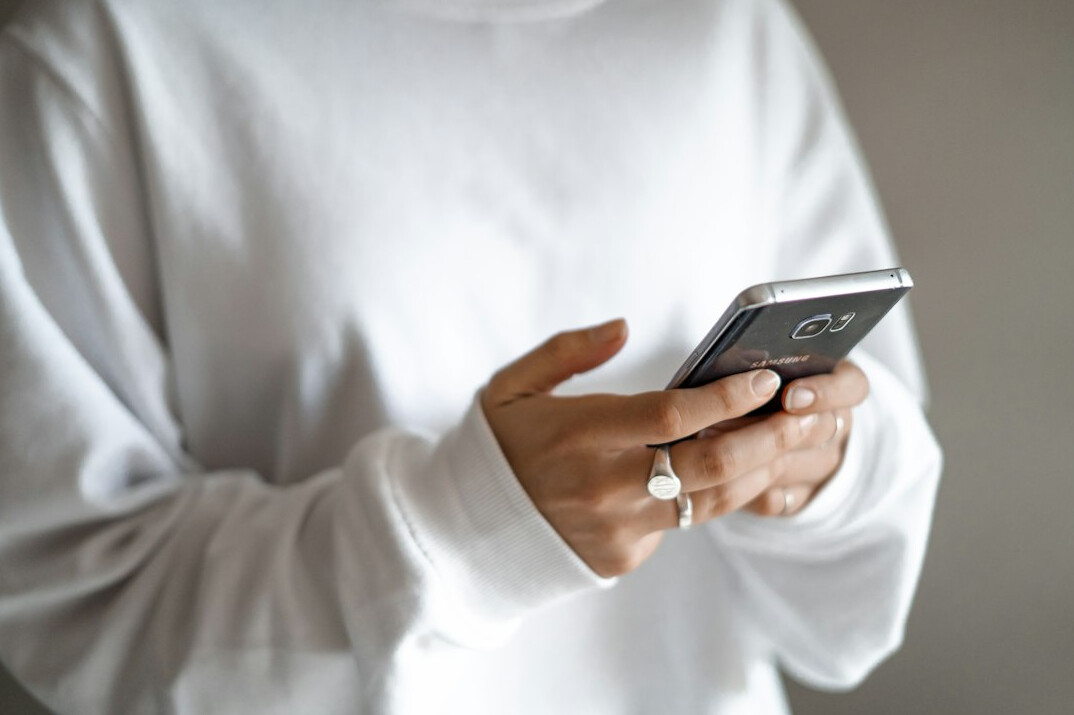 person reading news on phone