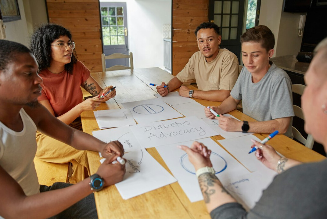 diverse group discussing at table