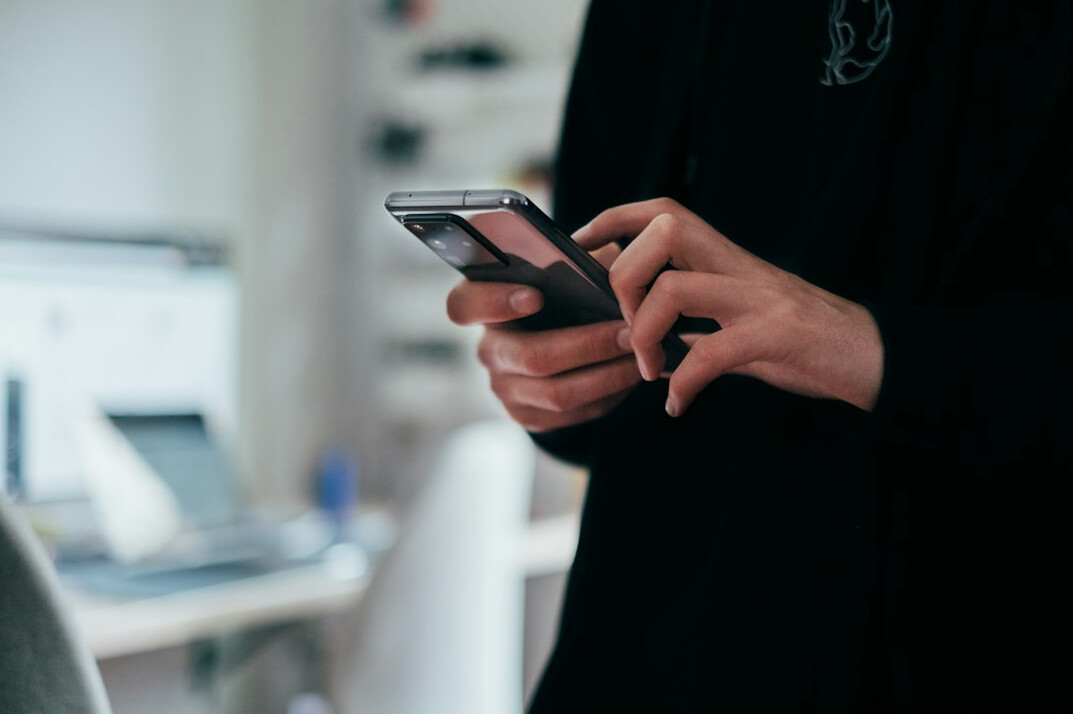 person reading news on phone