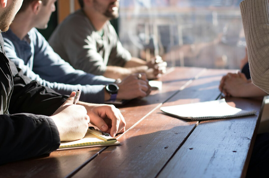 people discussing in meeting