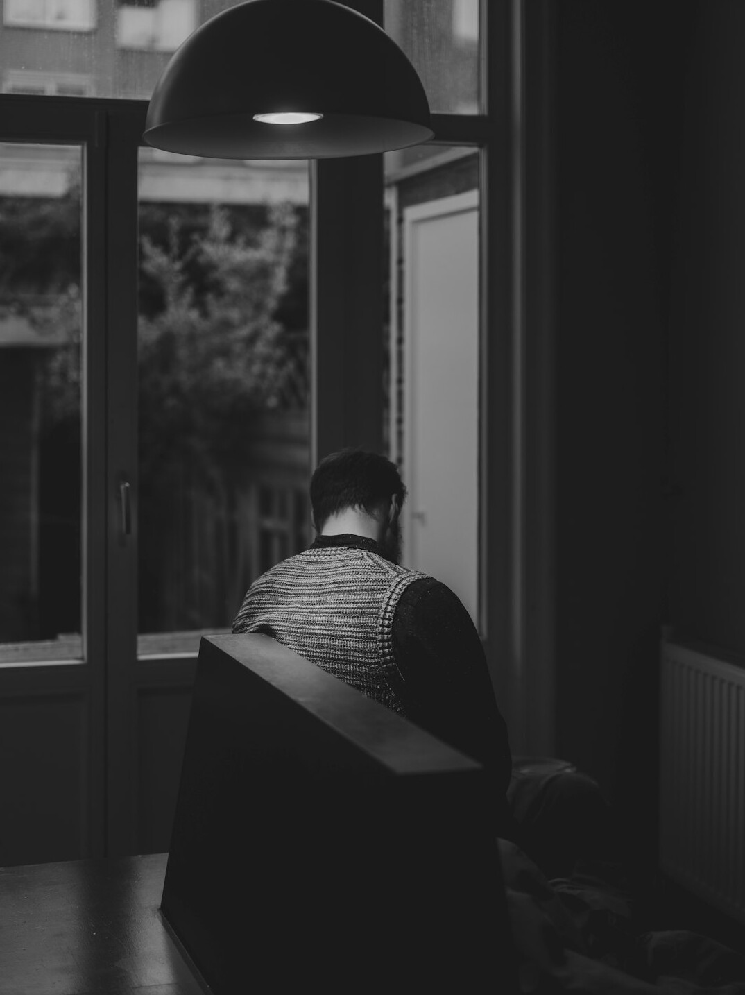 elderly man reading in quiet room