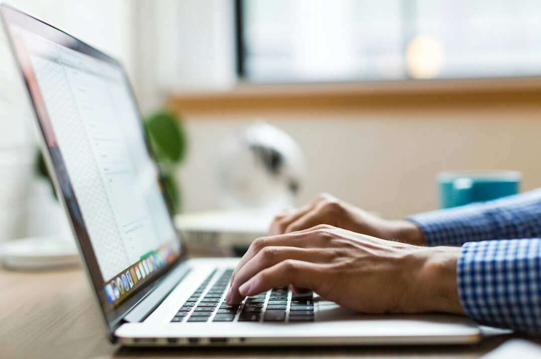 person checking facts on laptop